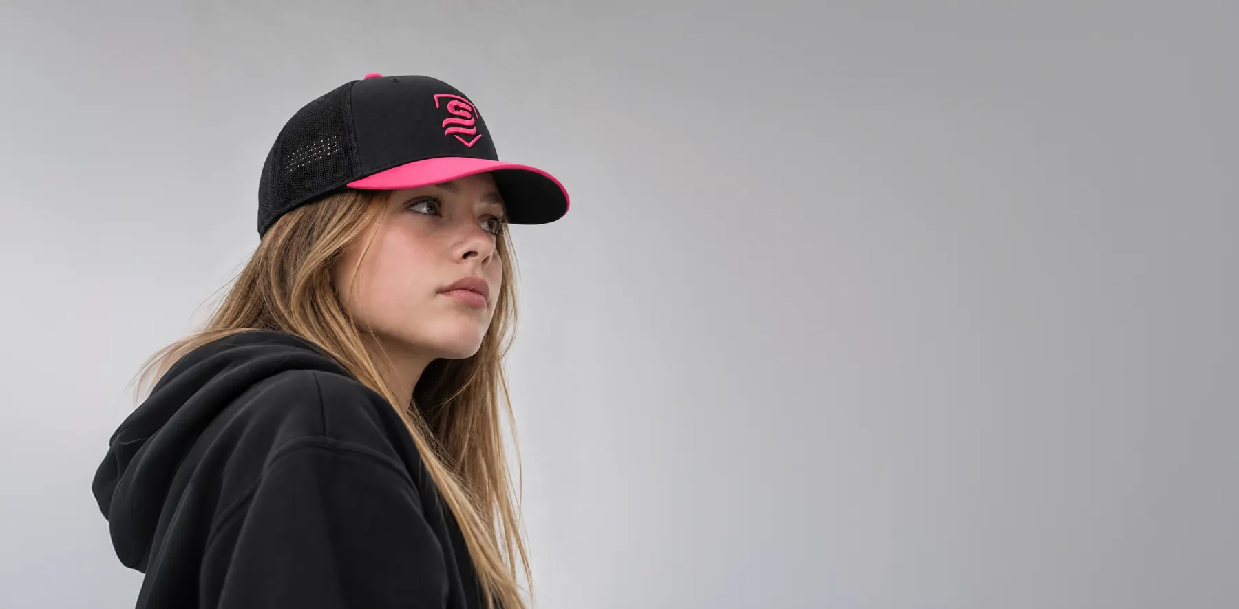 Player wearing a black and pink USSSA Pink Out cap